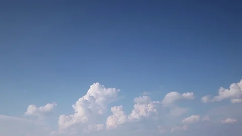 Moving clouds on blue sky Stock Footage 79338377