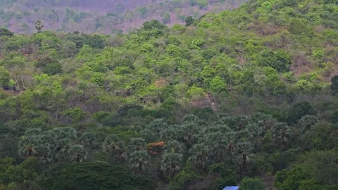 Moving Clouds creating beautiful shadows on a mountain Stock Footage 157380831