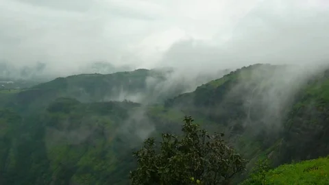 Moving Clouds in dark dense mountains, Tranquil scene,Lonavala Maharashtra India Stock Footage 107034668
