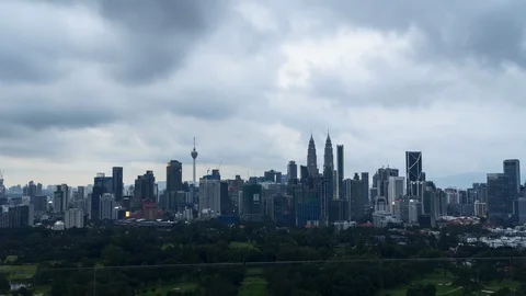 Moving clouds during dusk over Kuala Lumpur skyline Stock Footage 107348072