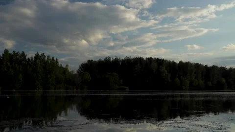 Moving clouds during sunset over Danube river, Slovakia Video stock 146335855