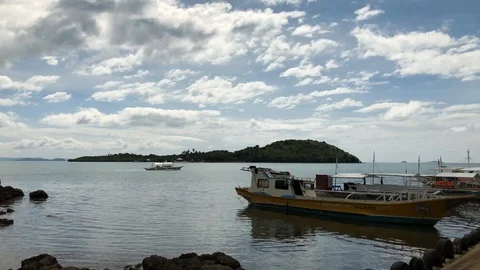 Moving clouds at a local harbor - Motion Timelapse Stock Footage 102394800