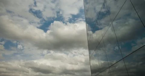 Moving Clouds Mirrored Reflection in Building Glass Windows Stock Footage 65445074