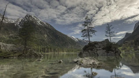 Moving Clouds mirroring in Lake Hintersee, Berchtesgaden Stock Footage 167694055
