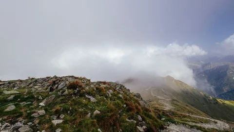 Moving Clouds in a mountain Stock Footage 94738749