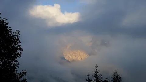 Moving clouds in the mountains alps Видео 96990237