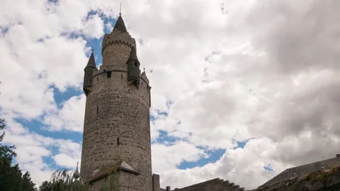 Moving clouds over the ancient tower of Friedberg Видео 135868828