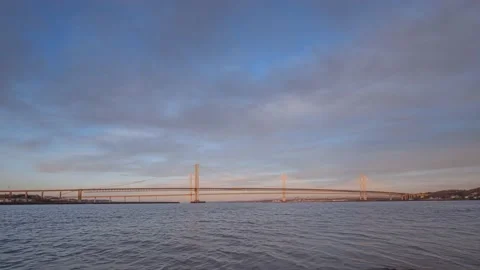 Moving clouds over the bridges over the sea bay at sunset Stock Footage 226657464