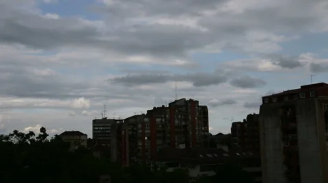Moving clouds over Building Stock Footage 44411569