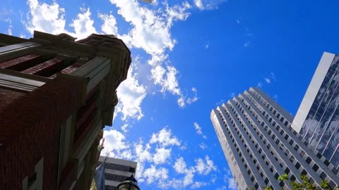 Moving clouds over buildings MOV Stock Footage 231591717