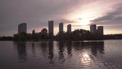 Moving Clouds Over City Lake at Sunset. 4K UHD Time-lapse. Stock Footage 241542507