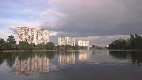 Moving Clouds Over City Lake. 4K UHD Time-lapse. Stock Footage 241542867