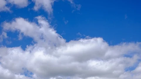 Moving clouds over deep blue sky time lapse video Stock Footage 93513855