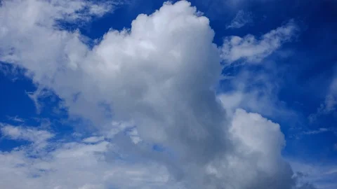 Moving clouds over deep blue sky time lapse video Stock Footage 93513918