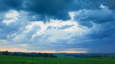 Moving clouds over field an sunset, timelapse Stock Footage 43098613