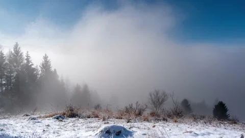Moving clouds over the misty landscape, mountain peaks in the background Stock-Footage 146046196
