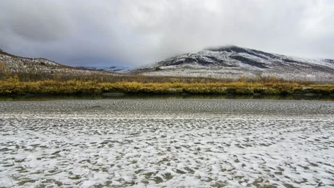 Moving clouds over a mountain landscape with snow, Sarek, Sweden Video stock 154888189