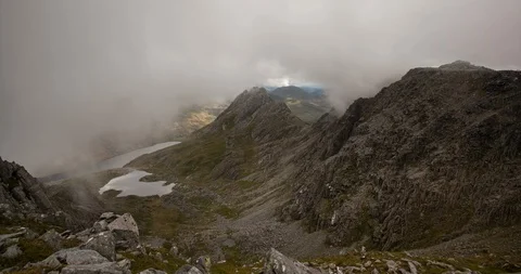 Moving clouds over mountains in Snowdonia National Park, Wales Stock Footage 93901418