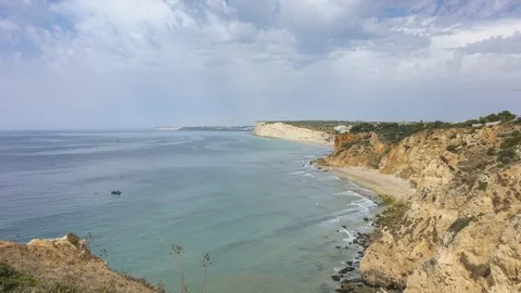 Moving clouds over Praia do Canavial Видео 95431301