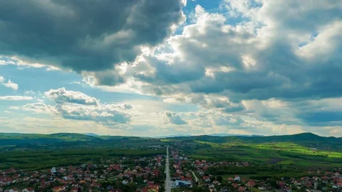 Moving clouds over small village town in Europe. Stock Footage 129849514