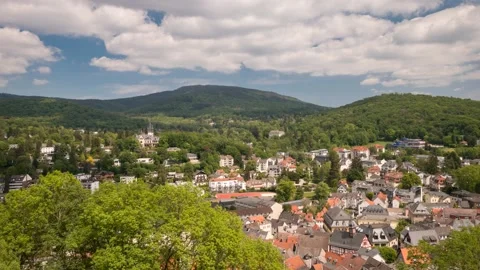 Moving clouds over Taunus low mountain range as seen from castle Koenigstein Видео 130910658