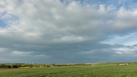 Moving clouds over a wheat field Video stock 129609387