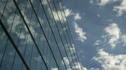 Moving clouds reflect onto office windows 스톡 동영상 42357256