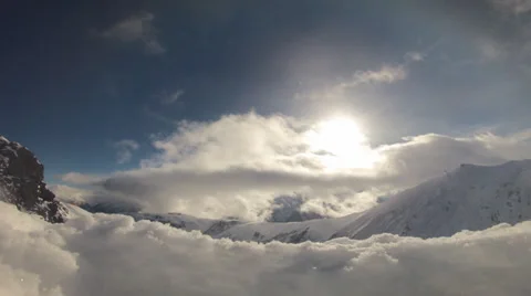 Moving Clouds at a snowy peak Stock Footage 35222682