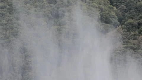 Moving clouds throught the mountains and the forest Video stock 258667489