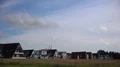 Moving clouds time-lapse at North Sea coast with holiday appartements and houses 4k or 4k+ Resolution