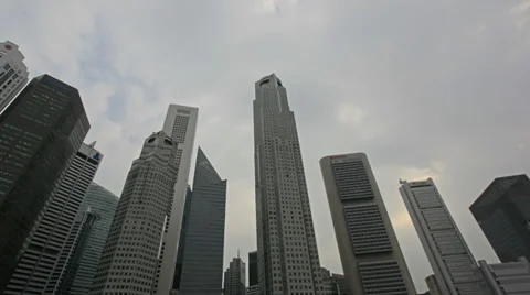 Moving Clouds Time Lapse over Skyscraper Buildings in Downtown Singapore Stock Footage 35757455