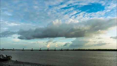 Moving clouds timelapse over matla river in canning westbengal Stock Footage 104301374