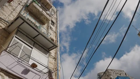 Moving clouds timelapse over old stone building Видео 339205232