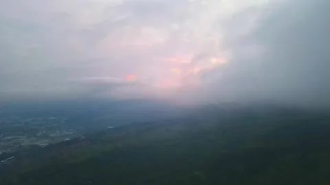 Moving clouds on top of a mountain at sunrise Stock Footage 255018109