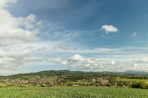 Moving clouds in two directions, above the village of the Krhova Beskydy Czec Stock-Fotos