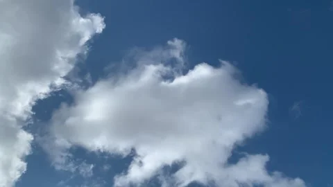 Moving clouds vertically with blue sky background. Stock Footage 242144323