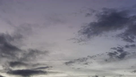 Moving clouds while colorful sunset in front of blue sky time lapse Stock Footage 221857451