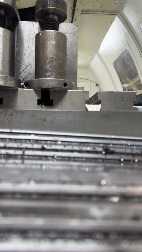 Moving CNC milling machine table in motion during operation. Video stock 325649251