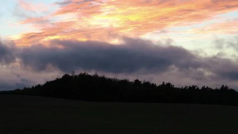 Moving colourful clouds at dusk Stock Footage 153218166