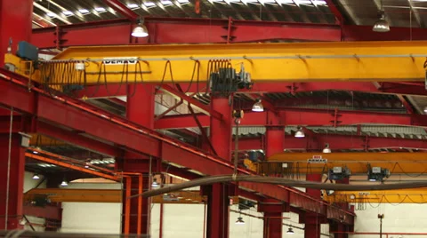 Moving Crane Hoisting in Factory Stock Footage 33761359