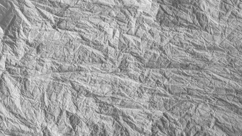 Moving crumbled up paper background fullscreen, stop-motion, slow version. Vidéo 153132938