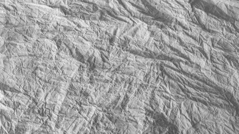 Moving crumbled up paper background fullscreen, stop-motion, fast version. Stock Footage 153199306