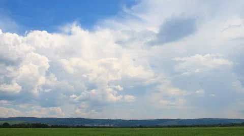 Moving cumulus clouds over field Stock Footage 41233435