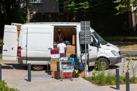 Moving Day Essentials: Loading a Van with Boxes Stock Photos