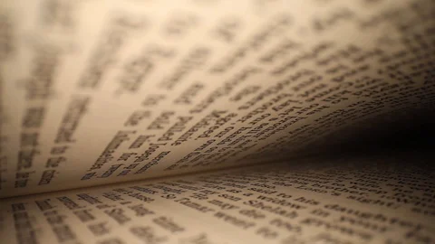 Moving diagonally through a book left to right, pages on top &amp; bottom of Stock Footage 116108480