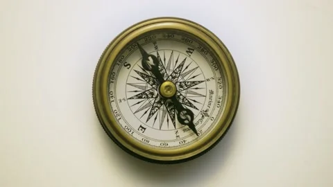 Moving dial of Compass on white background historic medieval looking object Stock Footage 156644331