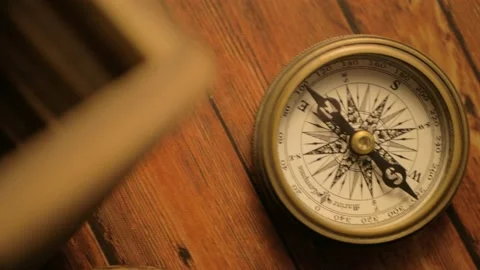 Moving dial of Compass on wooden base historic medieval looking object Stock Footage 156643846