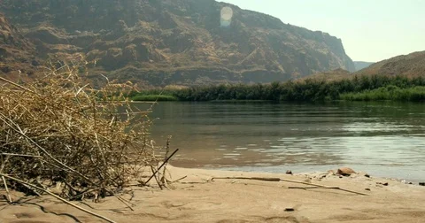 Moving dolly slider beach at Lee's Ferry Colorado River Grand Canyon Arizona 4K Stock Footage 77614097
