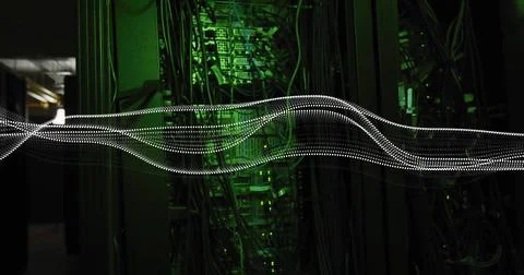 Moving dotted white light trail crossing server aisle, lighting racks, cable Stock Photos