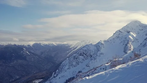 Moving down by the beautiful snowy ridge of caucasus mountains under clear blue Stock-Footage 112369155